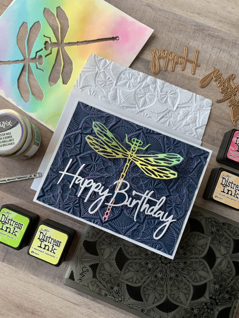 Dragonfly card surrounded by supplies