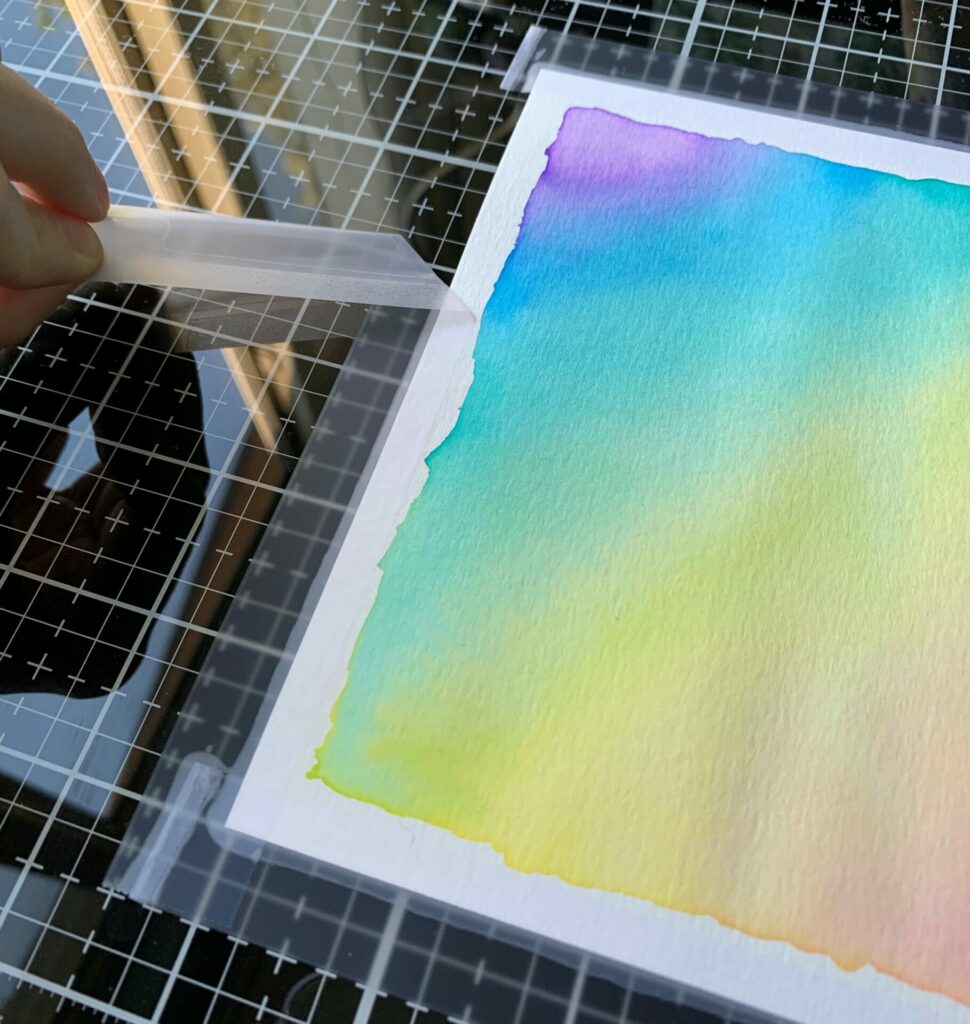 Removing tape from watercolor paper