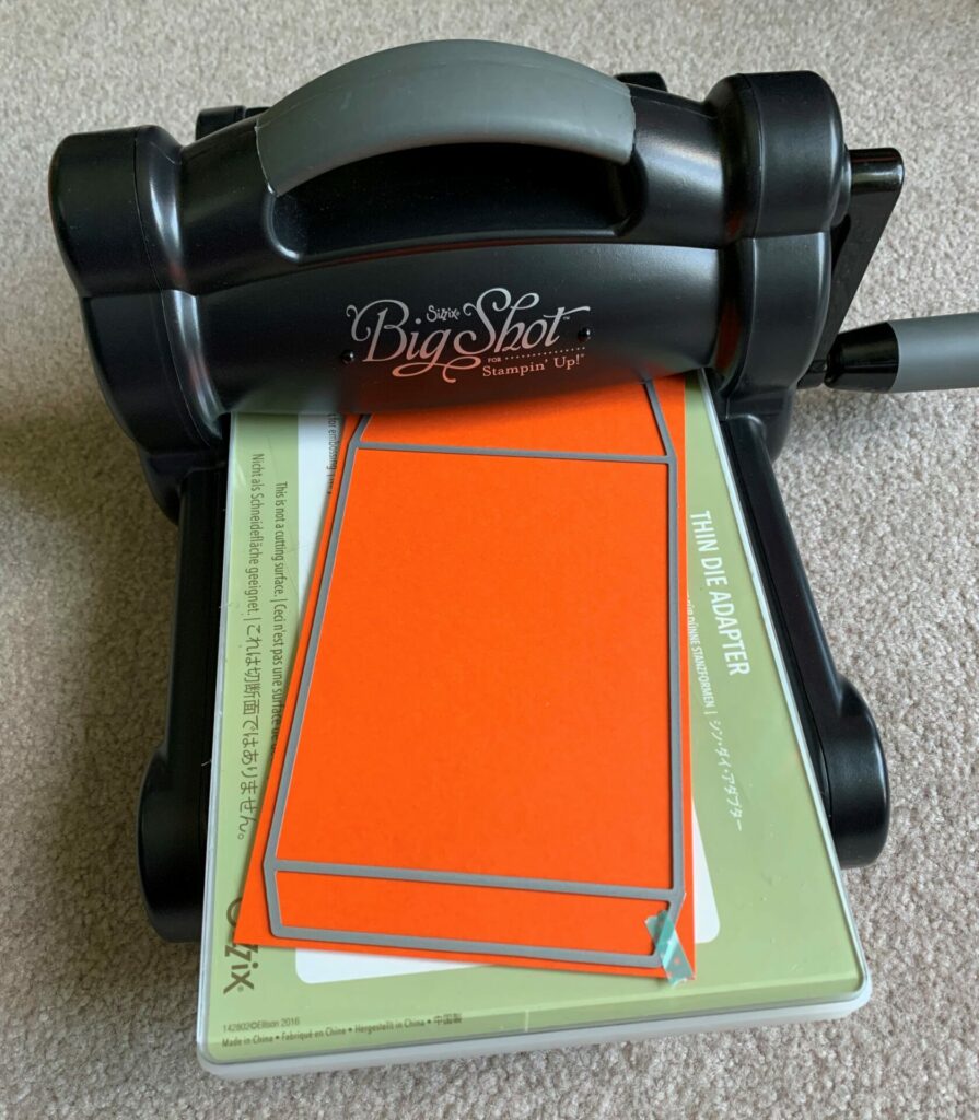 Die cutting the envelope front in the Sizzix big shot machine