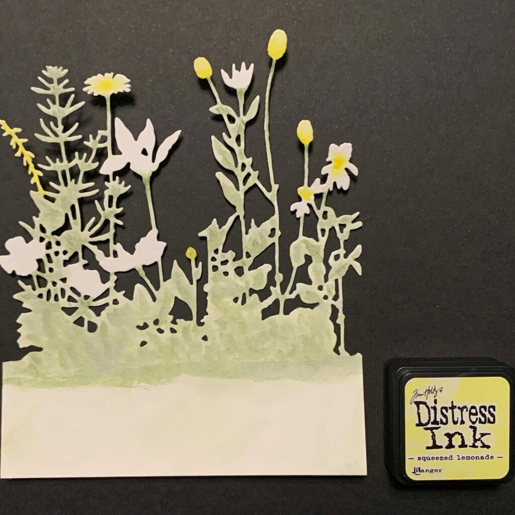 Watercoloring the wildflowers with yellow ink