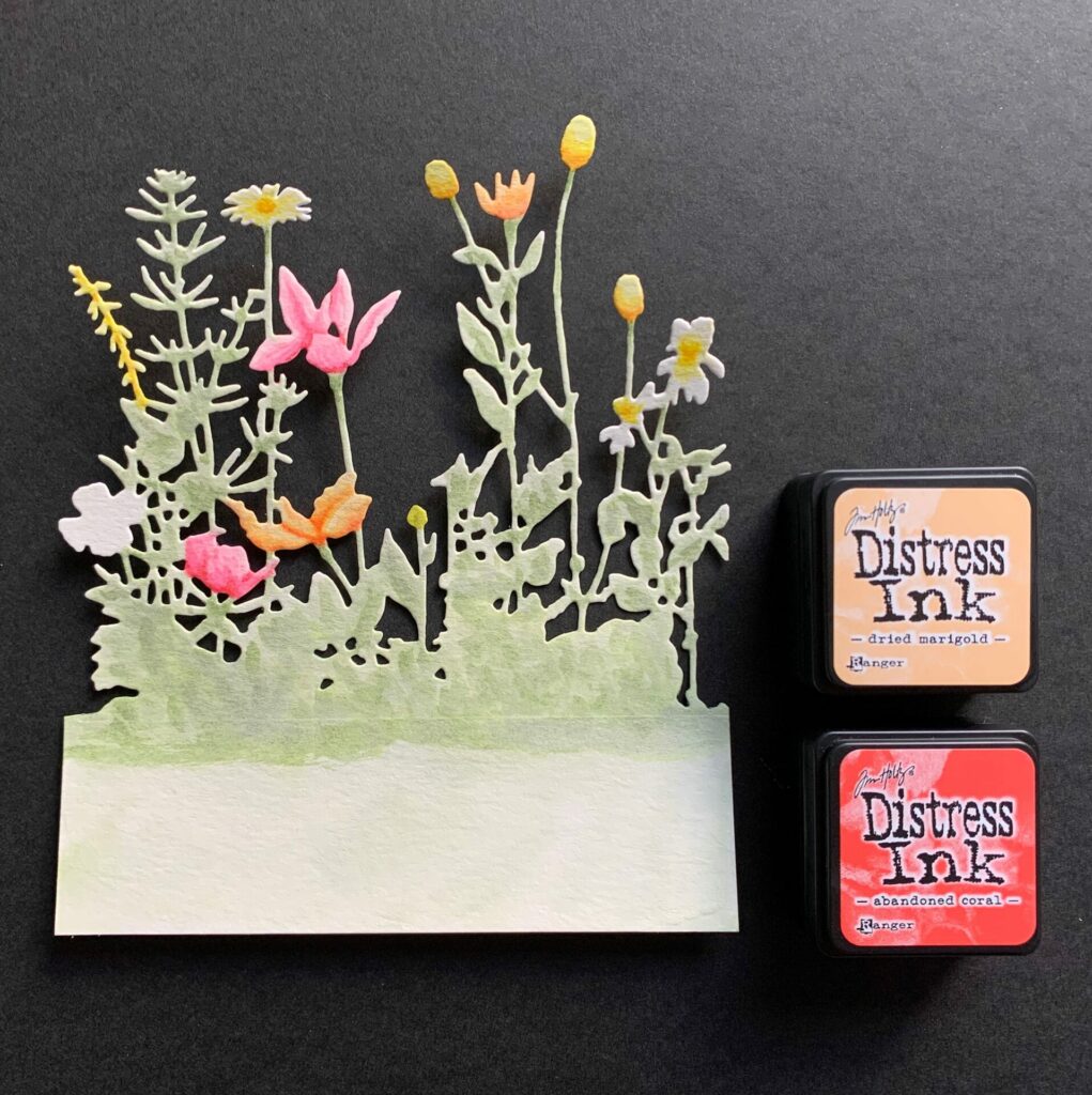 Watercoloring the wildflowers with orange ink