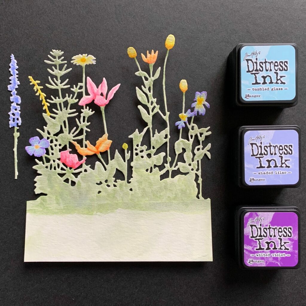 Watercoloring the wildflowers with purple ink