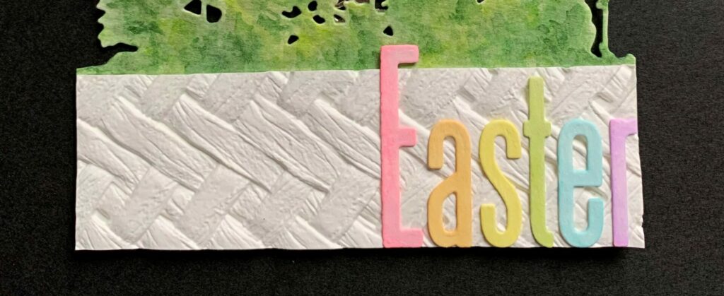 Easter letters glued onto the embossed panel