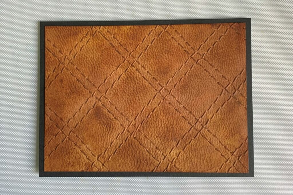 Quilted leather embossed background glued to card base