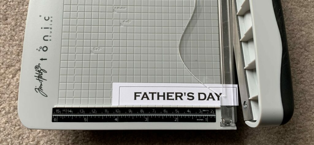 Trimming the Father's Day sentiment strip