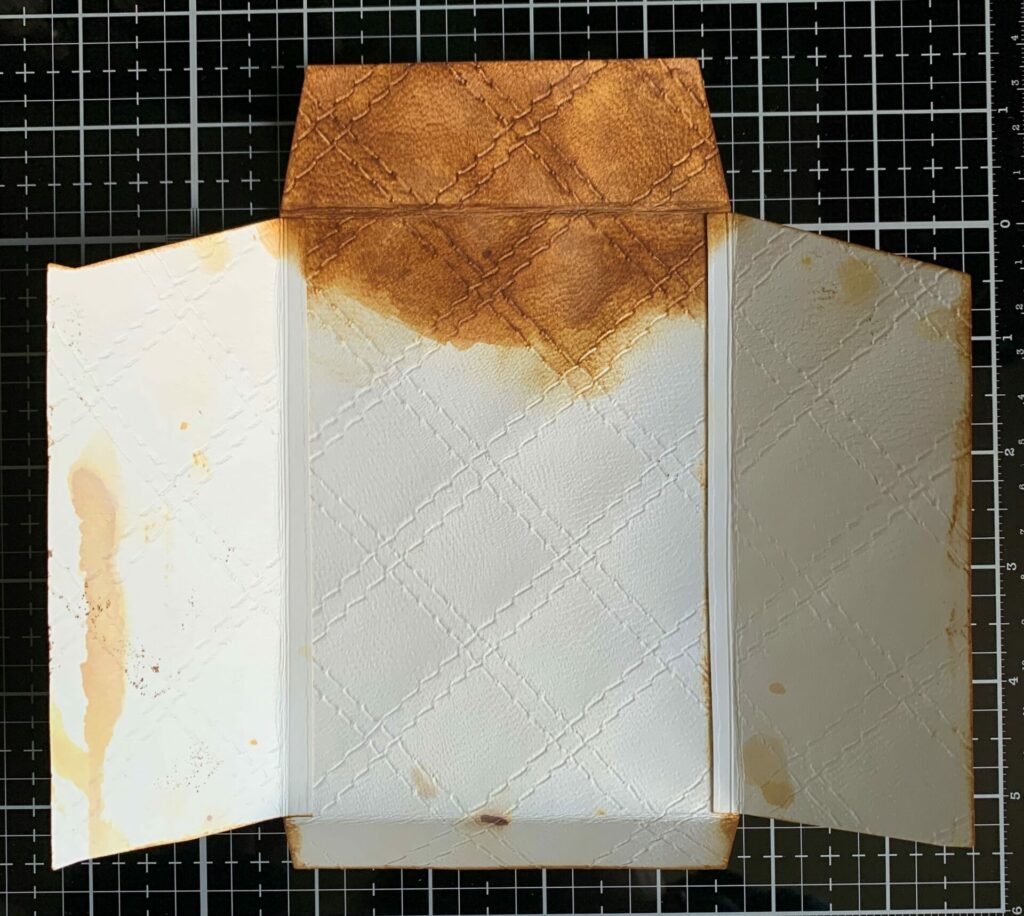 Inking the inside of the quilted leather envelope