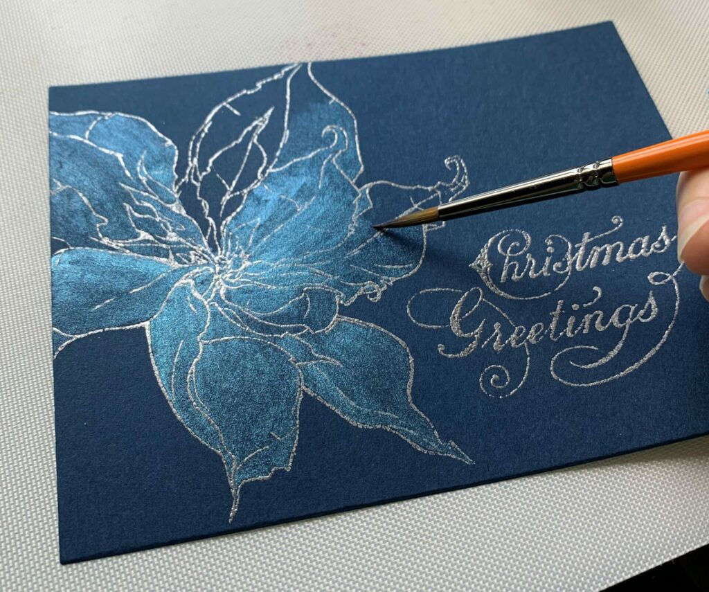 Coloring the poinsettia with distress mica stain