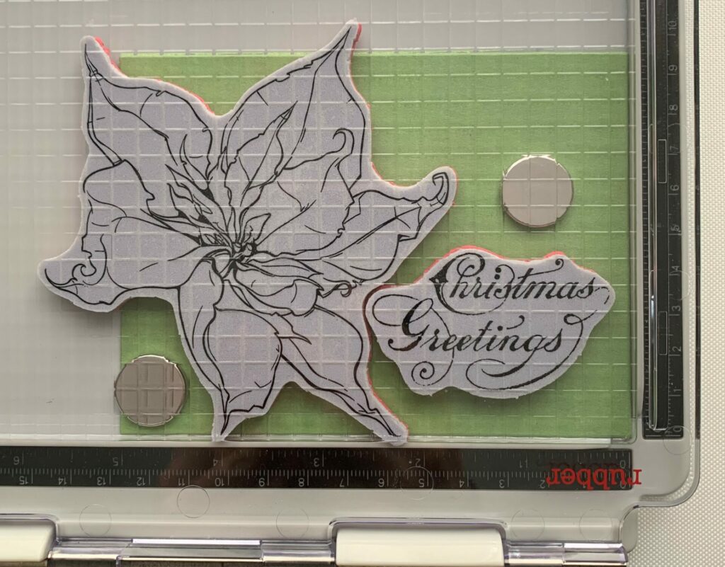 Stamp positioning for the poinsettia Christmas greetings card