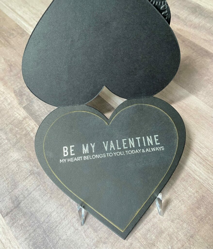 Embossed sentiment on the inside of the layered hearts valentine