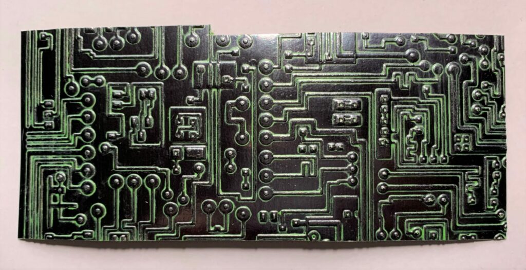 Green distress crayon on metallic embossed circuit paper