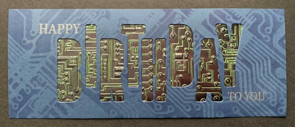 Gluing the 3D embossed circuit behind the card front