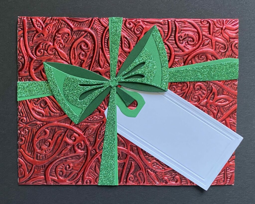 Attach the bow to the card.