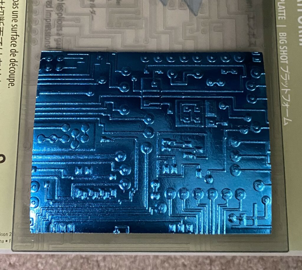 Embossing the metallic blue circuit