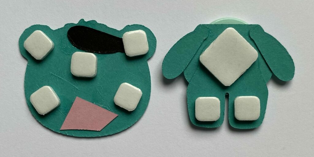 Adding foam squares to the back of the bear