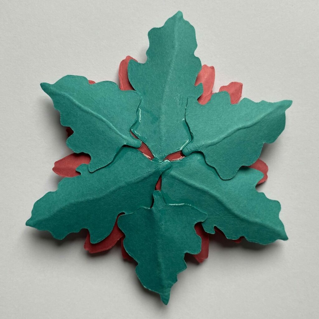 Gluing the leaves to the daisy 
