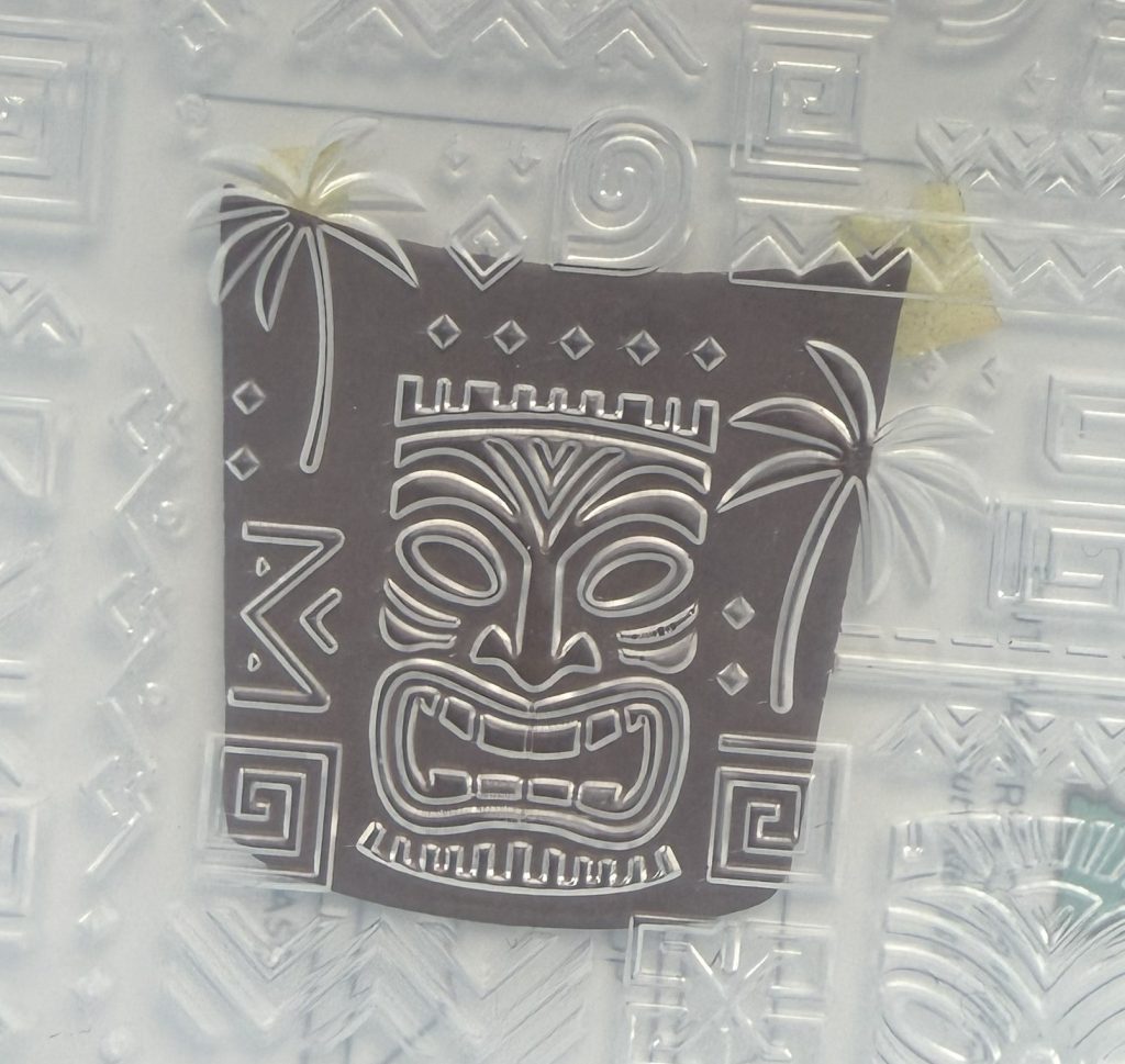 embossing the tiki face drum